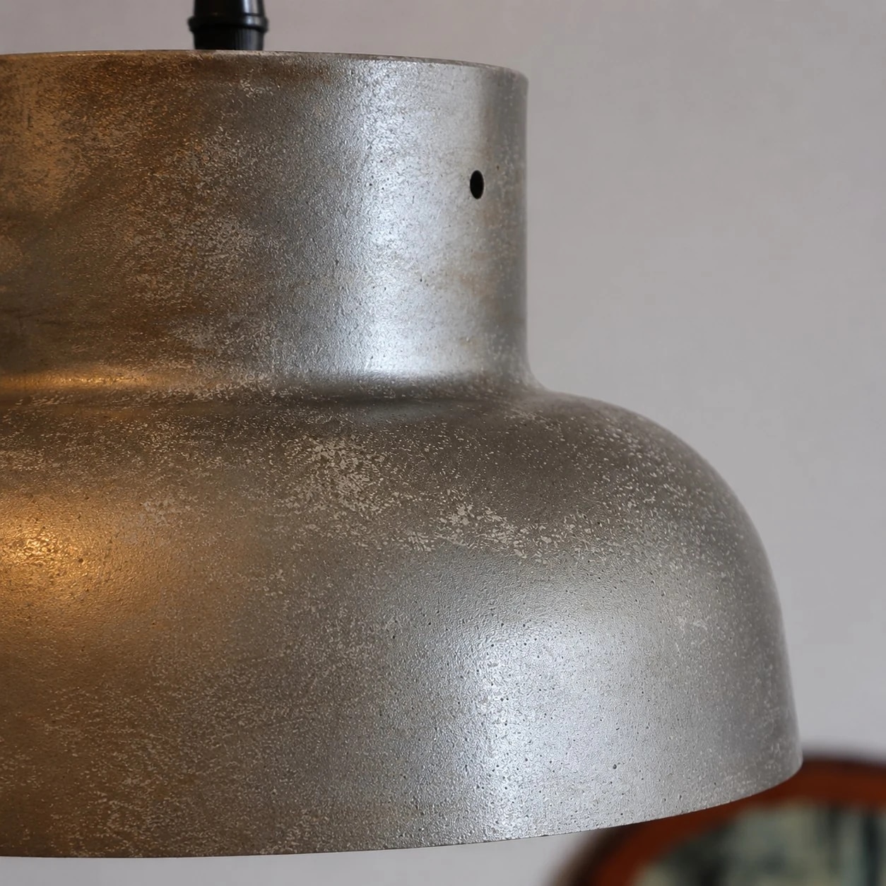 Close view of aged silver-gray metal shade texture