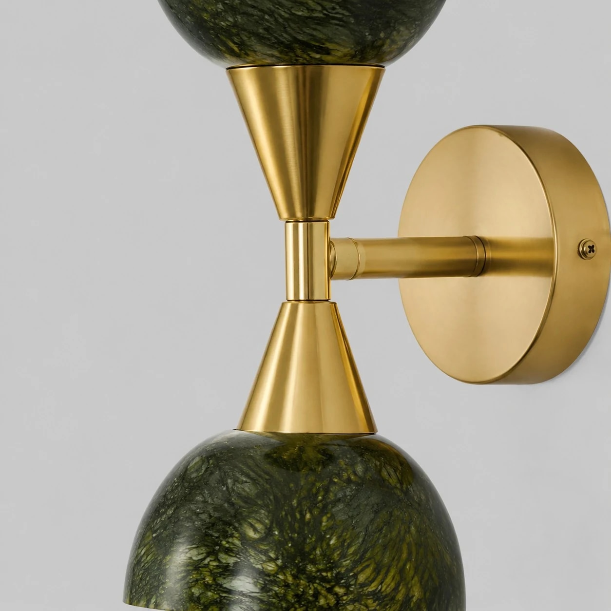 Jade green shade texture and gold-tone wall light detail