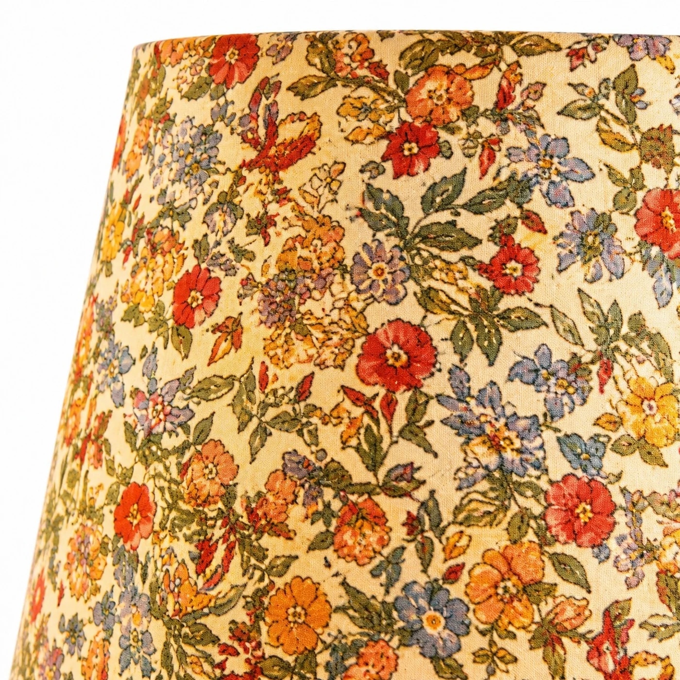 Floral fabric and carved wood details.