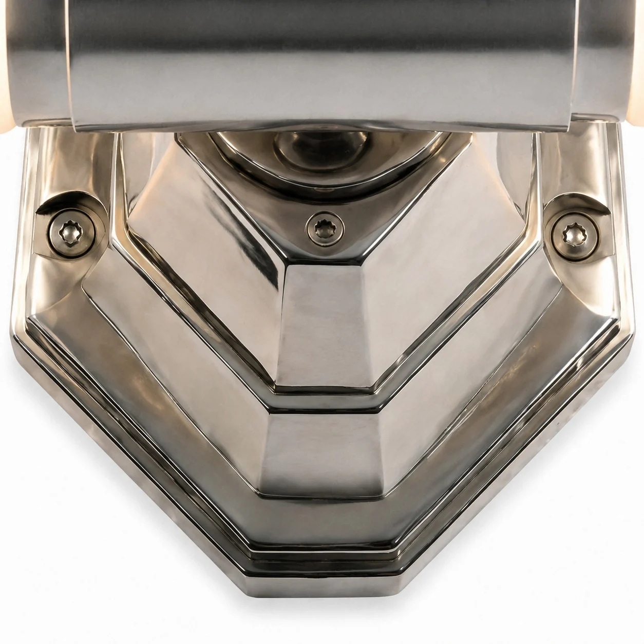 Close view of the faceted cast aluminum wall light base