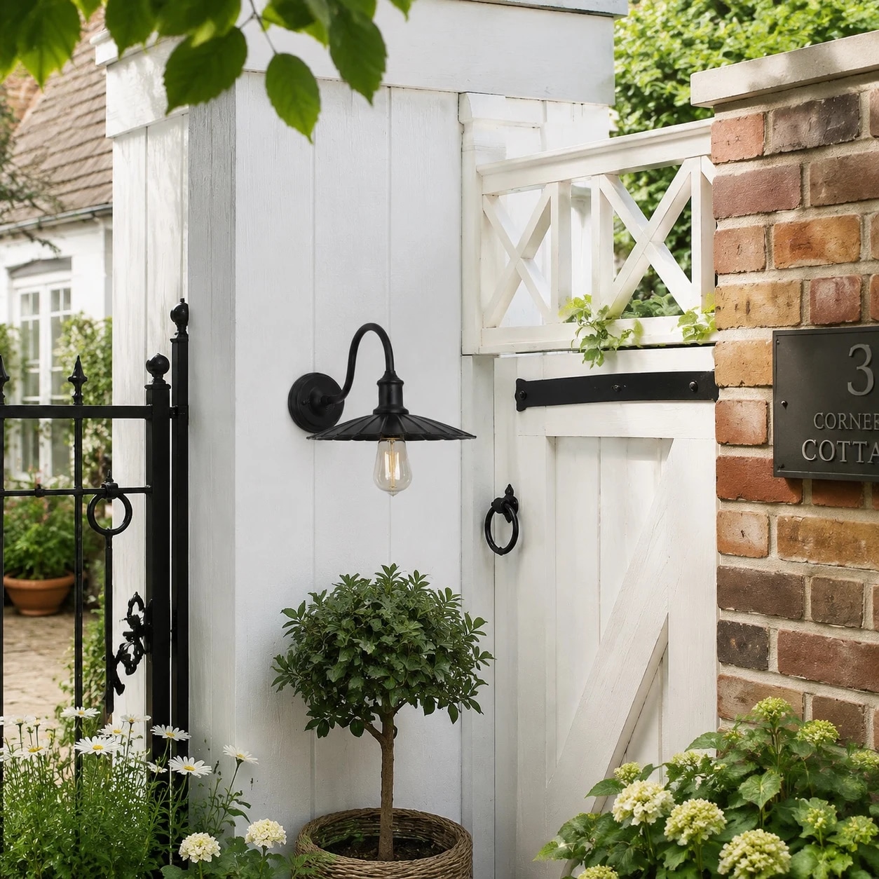 Outdoor wall lamp beside an entry gate