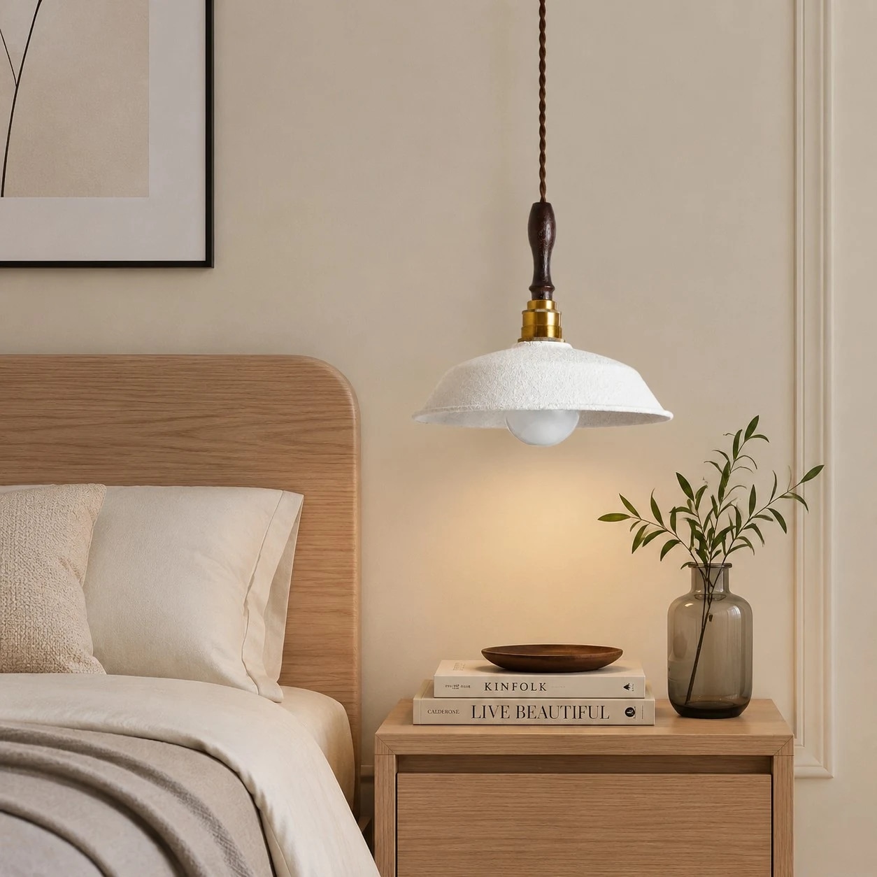 White metal pendant lamp installed beside a bed