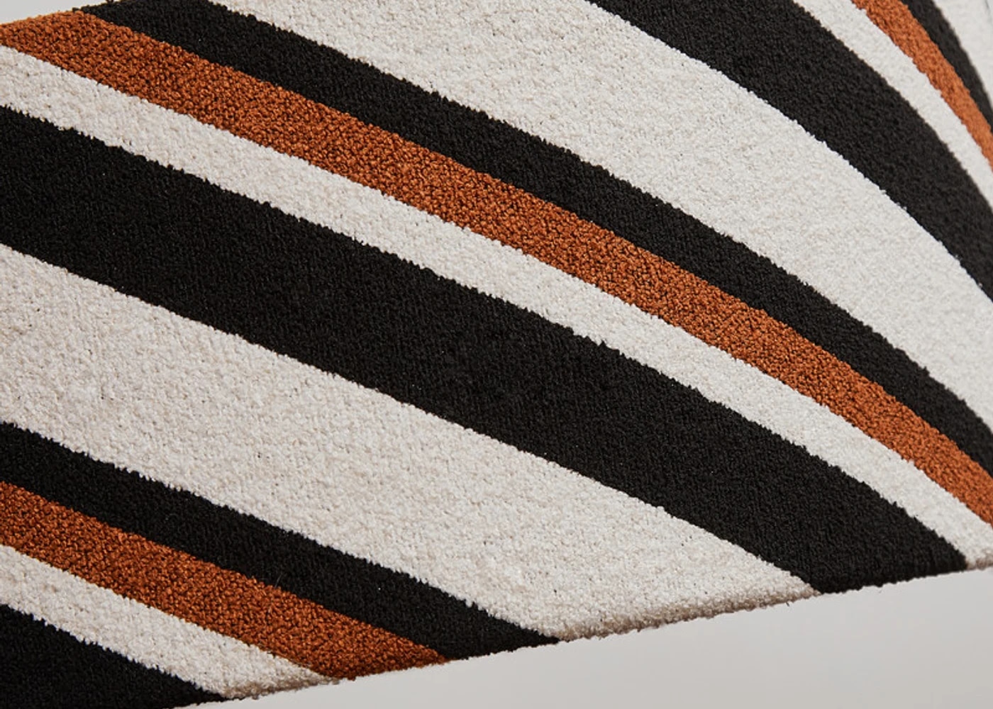 Woven cream black and rust diagonal fabric detail