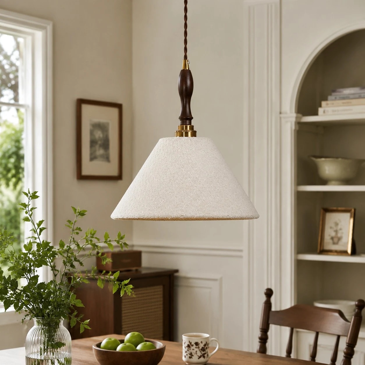 Cream fabric pendant above a dining table in a vintage room