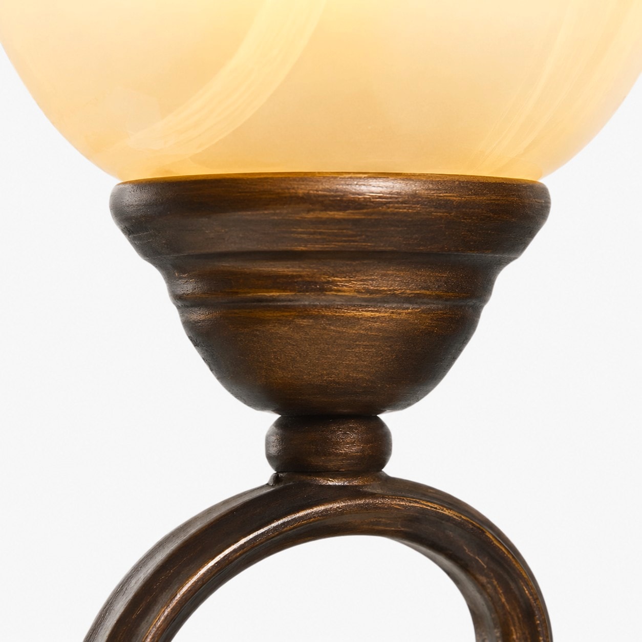 Frosted glass shade detail on a vintage wall sconce