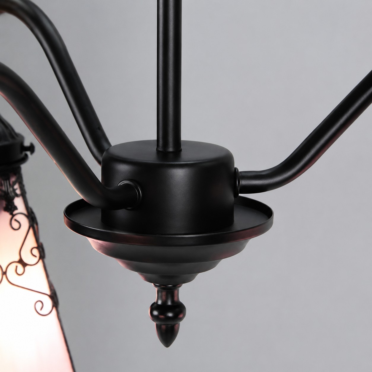 Black iron arm joint and center hardware detail