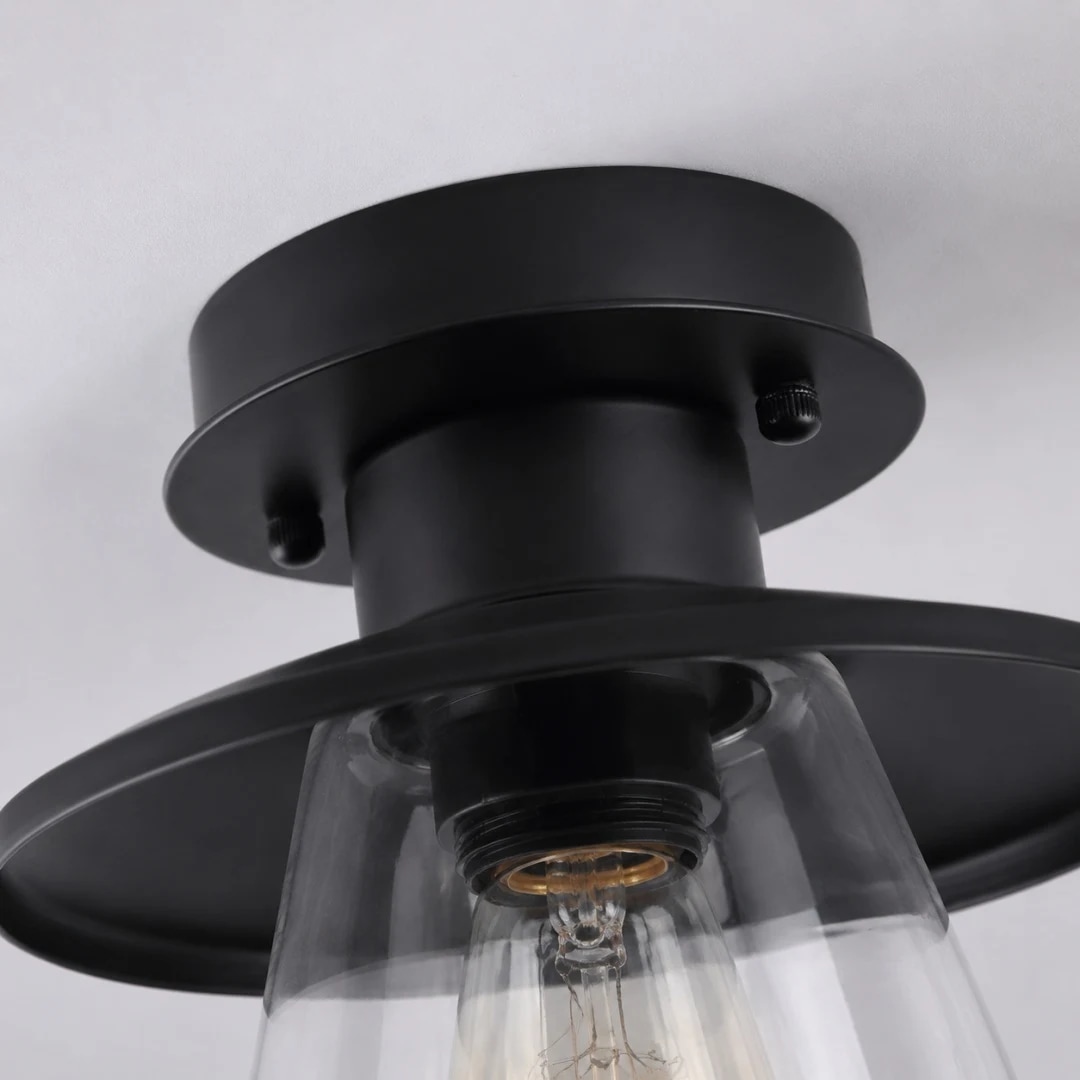 Black metal ceiling canopy and clear glass shade detail