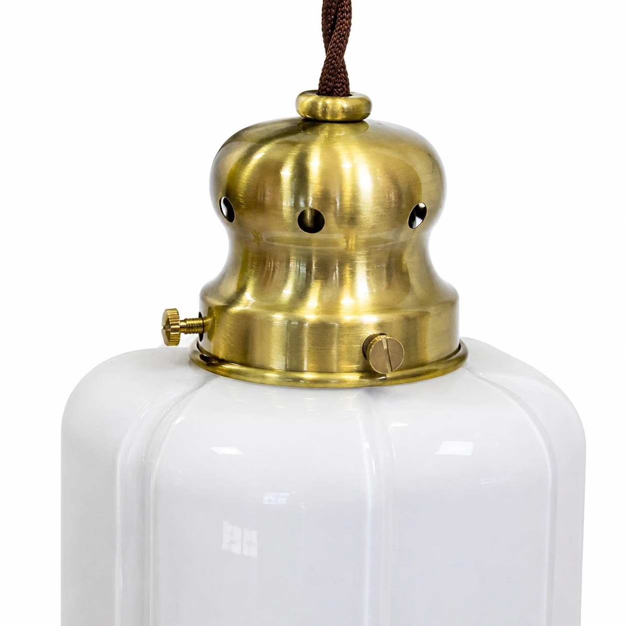 Close view of the brass lamp holder and white glass shade