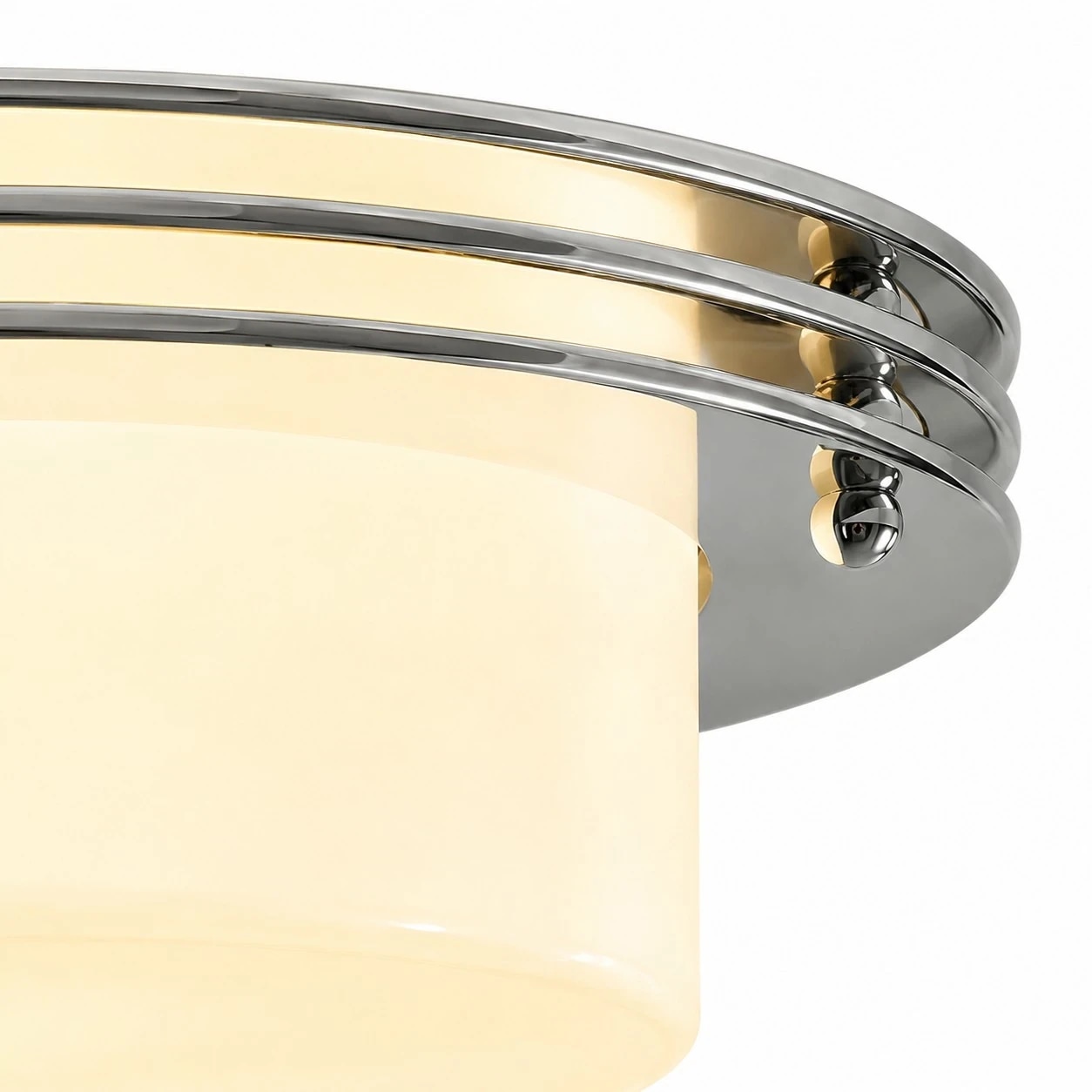 Low profile Bauhaus disc silhouette with chrome bands and milky glass shade