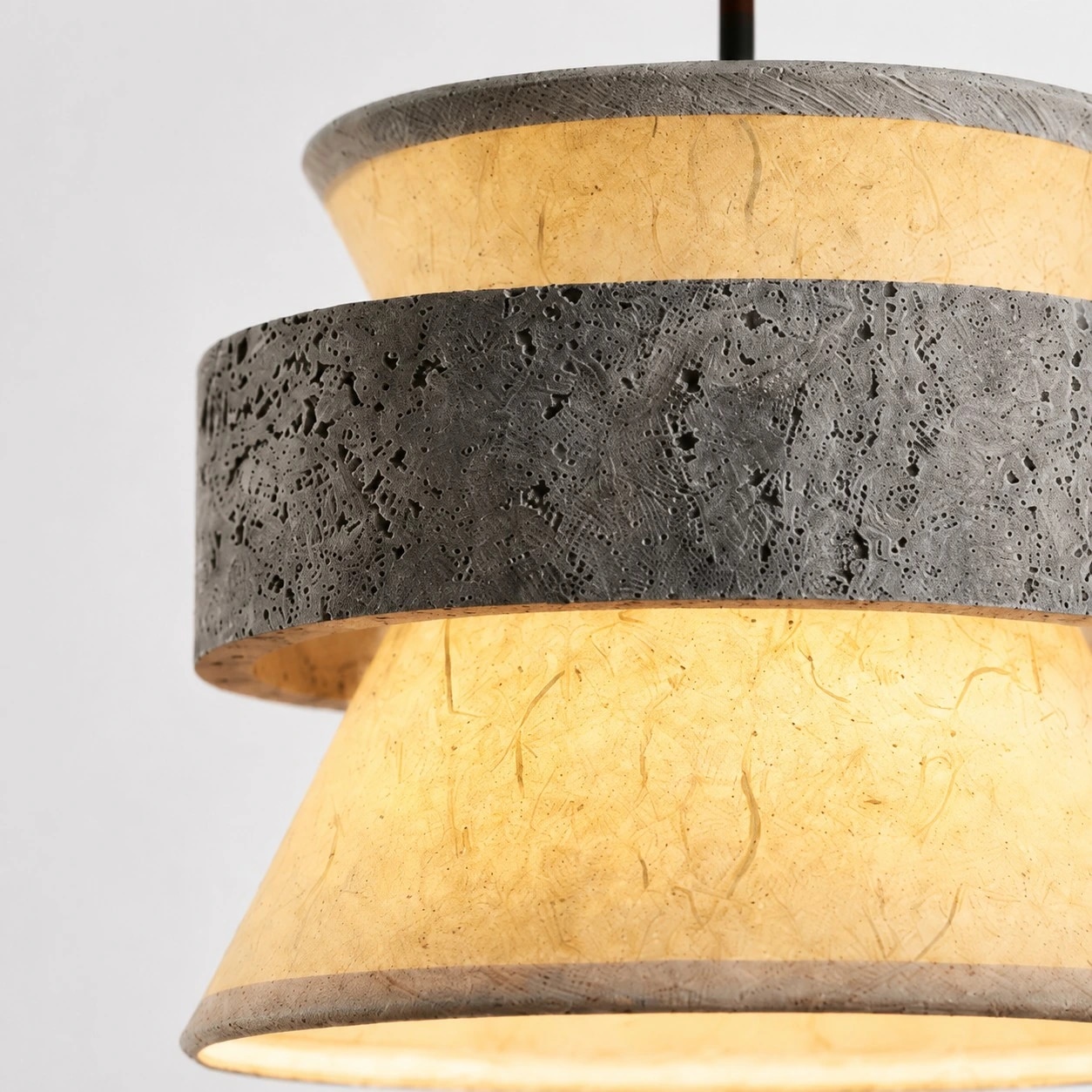 close view of grey stone texture and translucent paper shade