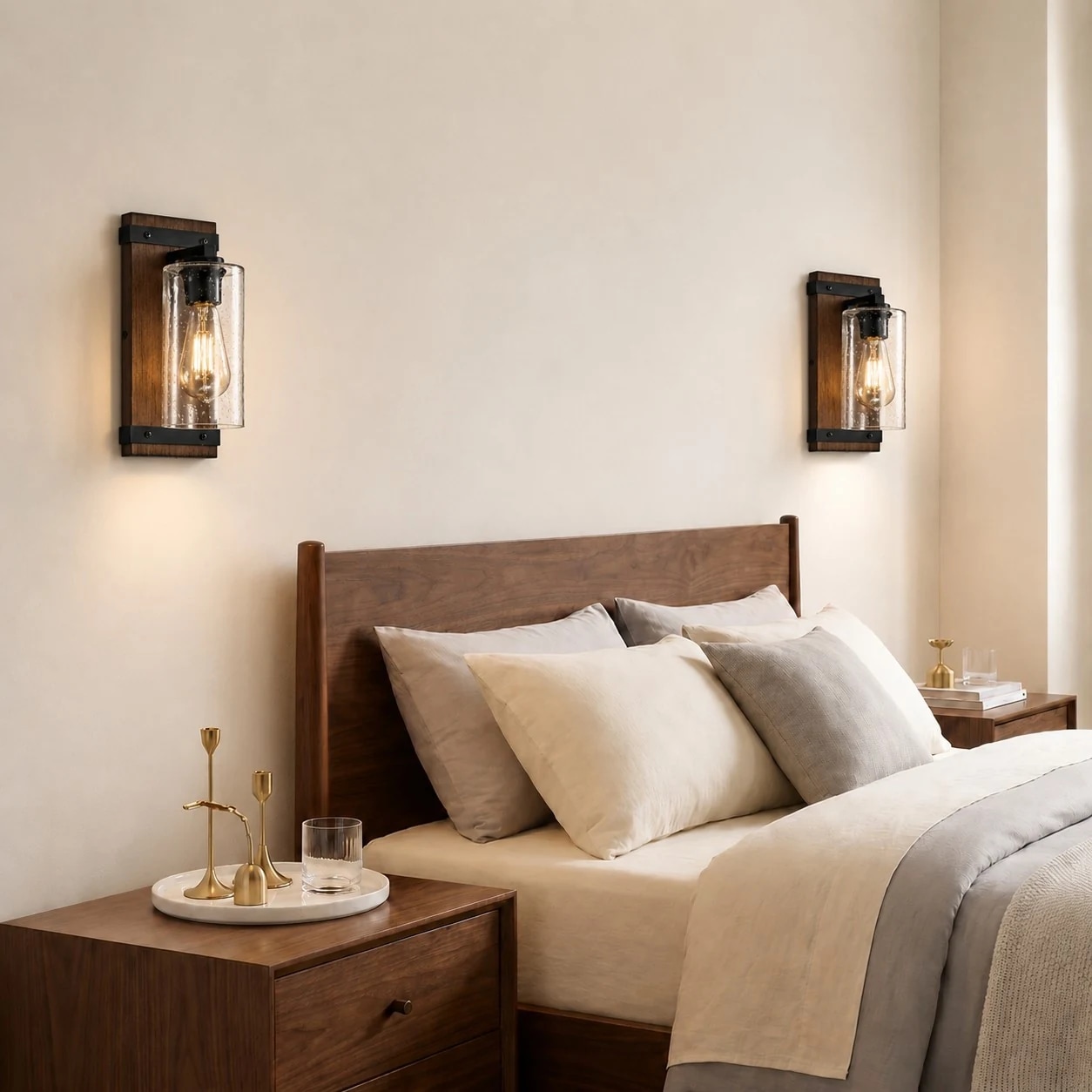 Vintage industrial glass wall sconce installed beside a bed
