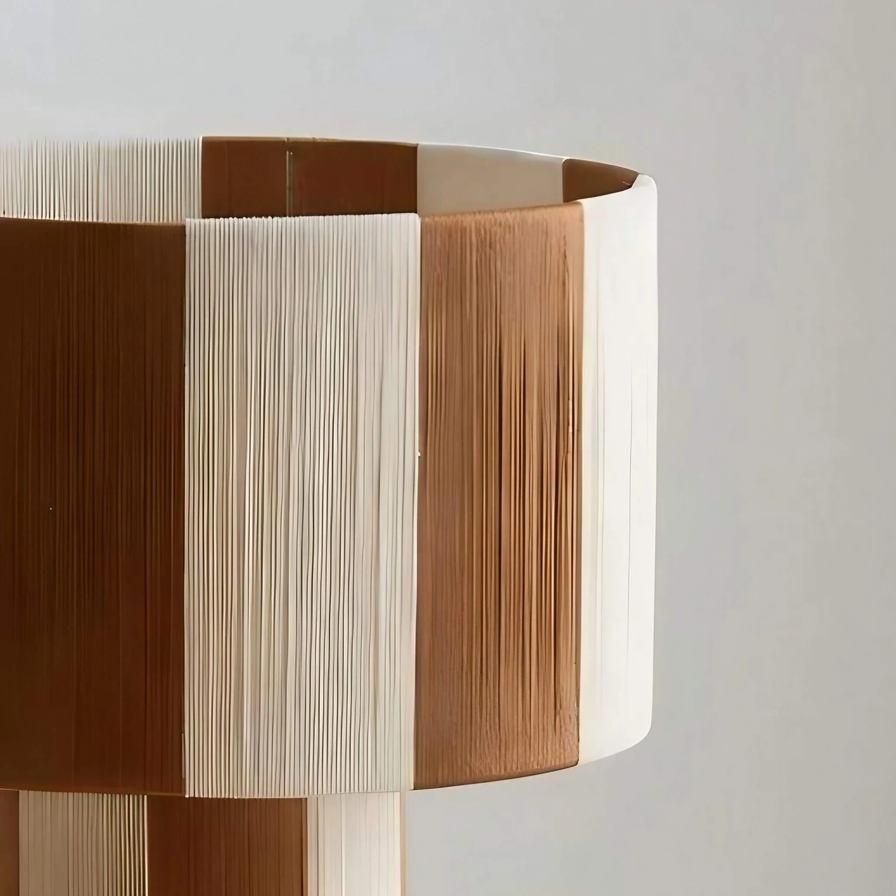 Close detail of coffee and cream woven lamp shade panels