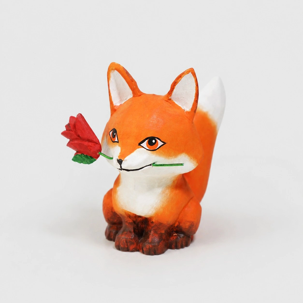Fuchs hält Rose