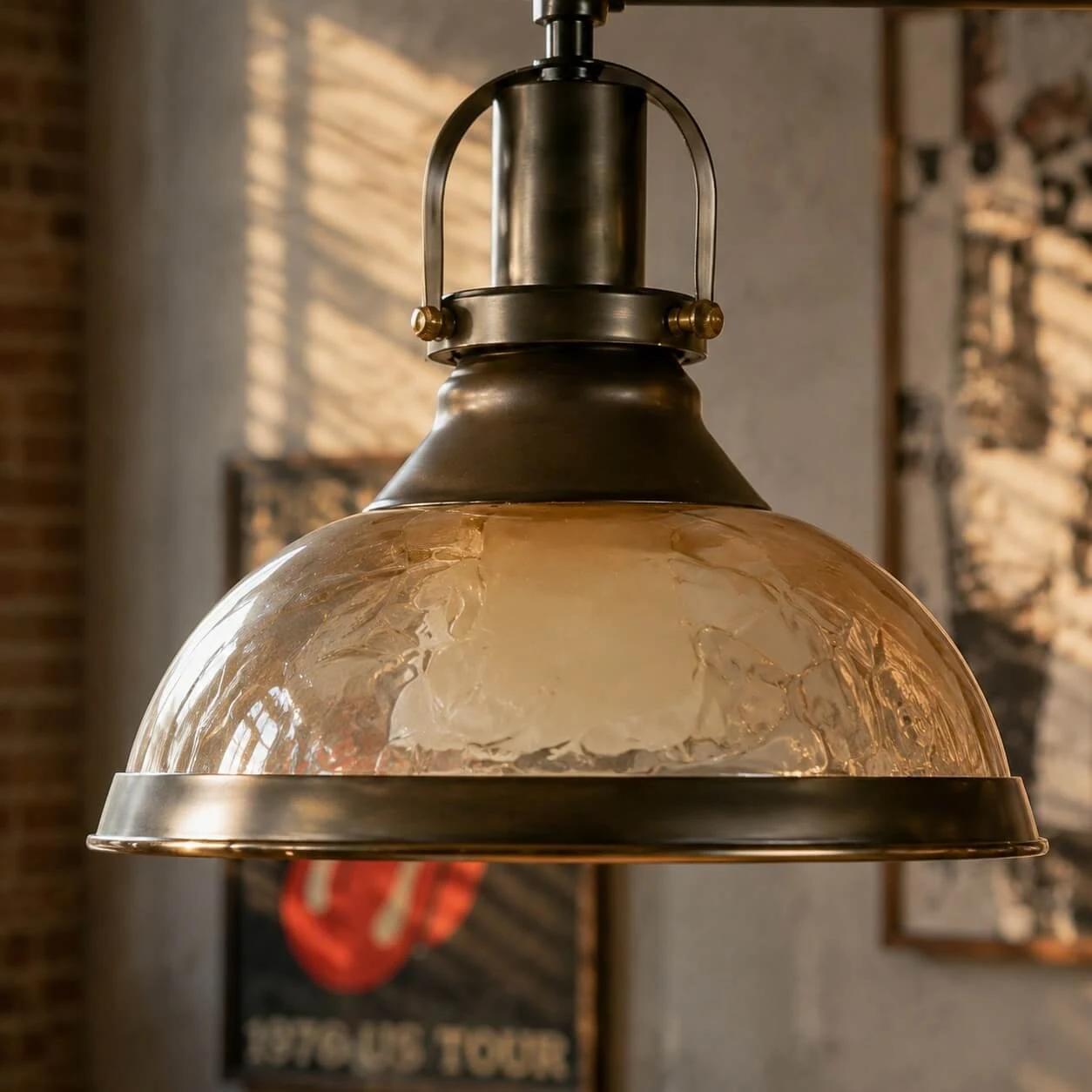 Close view of amber glass shade and antique metal holder