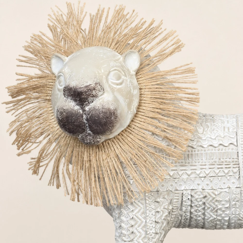 Close detail of the woven lion mane and glossy face