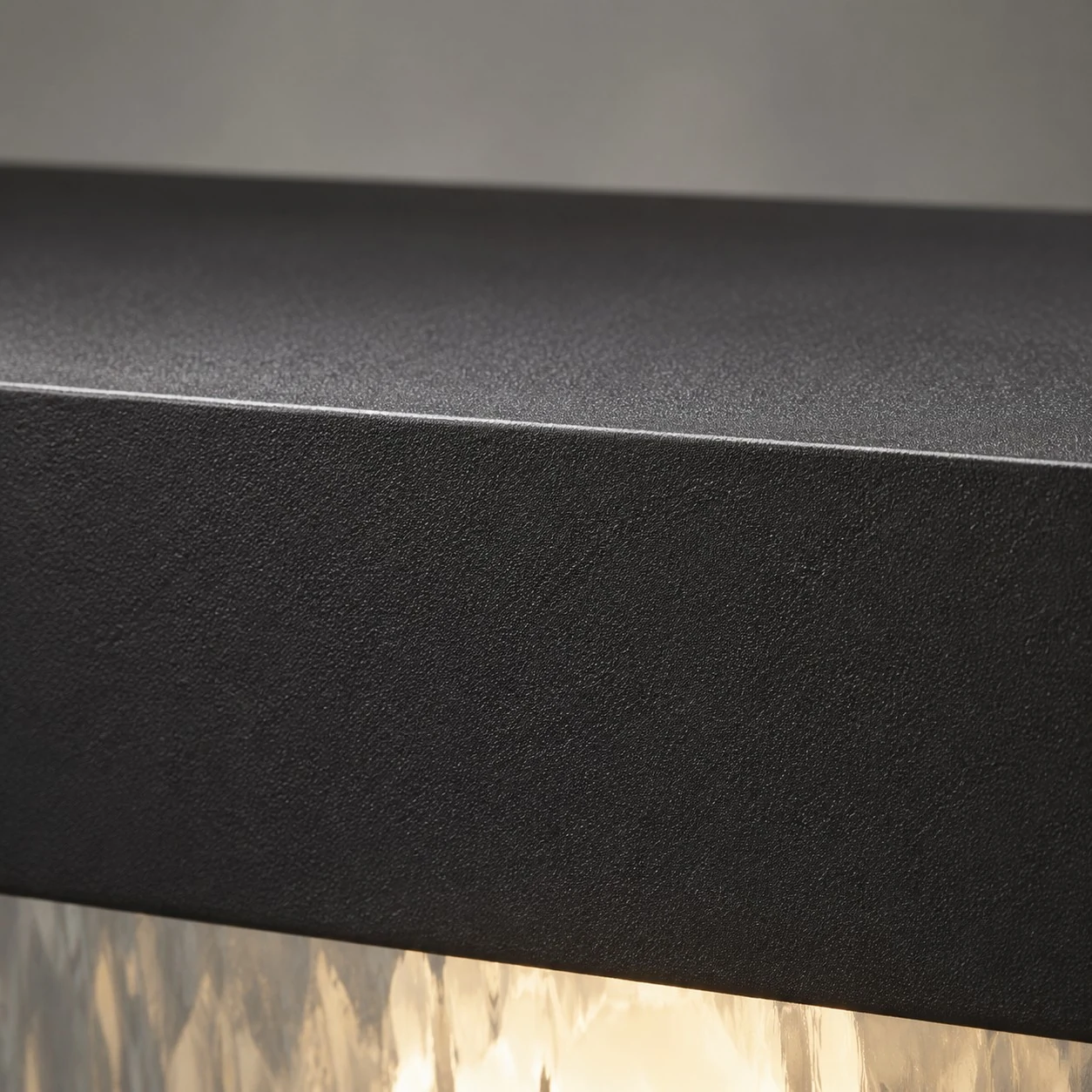 Close-up of matte black aluminum surface finish