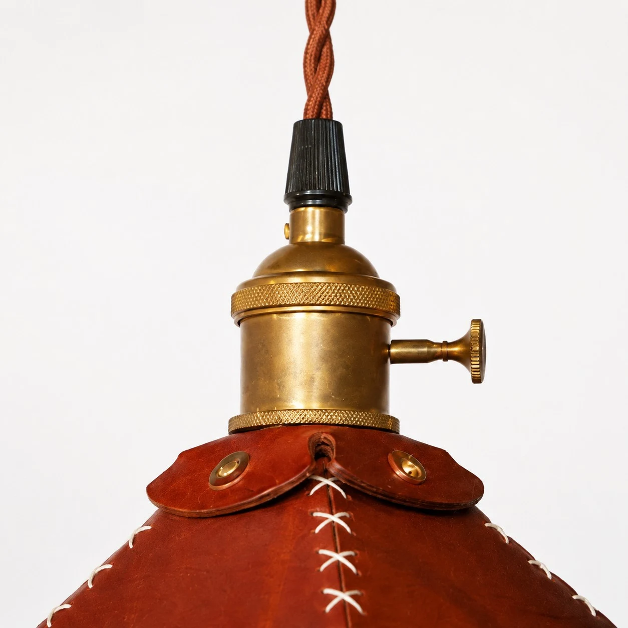 Antique metal cap and twisted cord detail