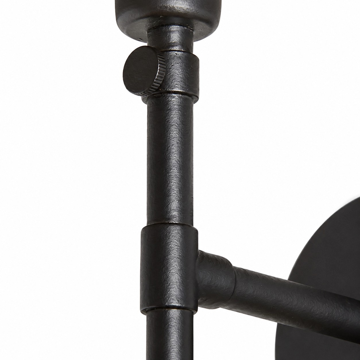 Close view of the black iron adjustment hardware