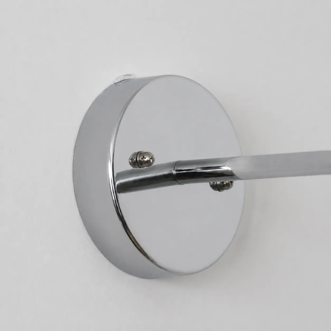 Wall plate and curved arm connection detail