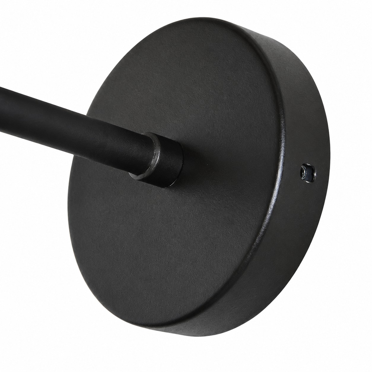 Close view of the round black wall mounting plate