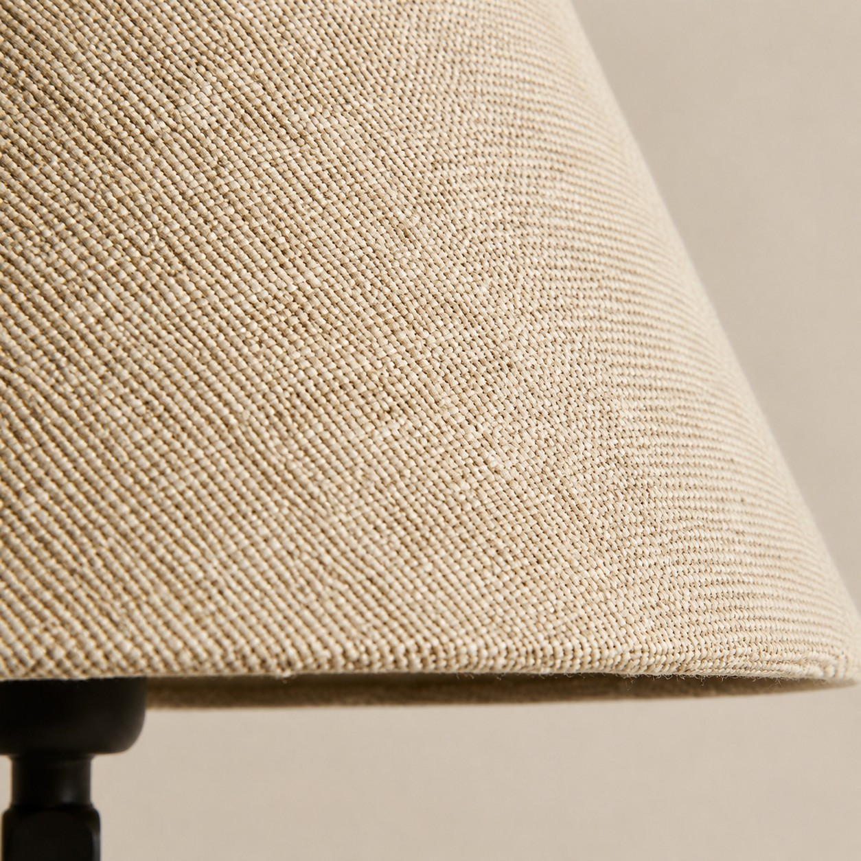 Close view of the natural beige woven fabric shade
