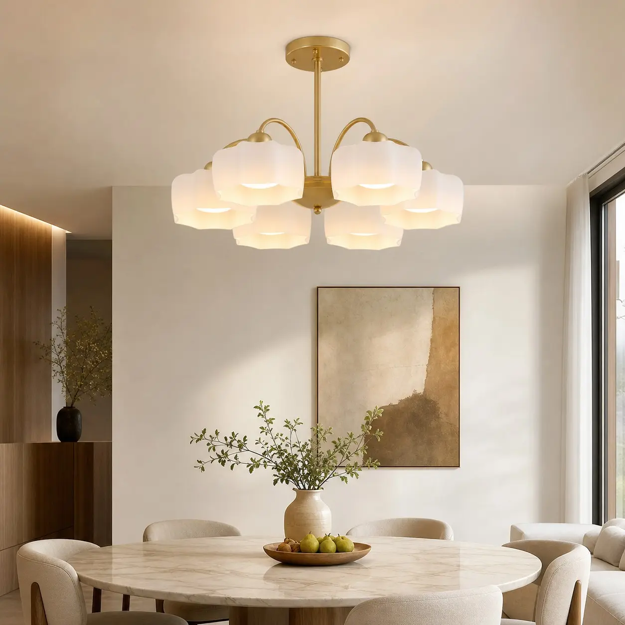 Gold chandelier above a modern dining table