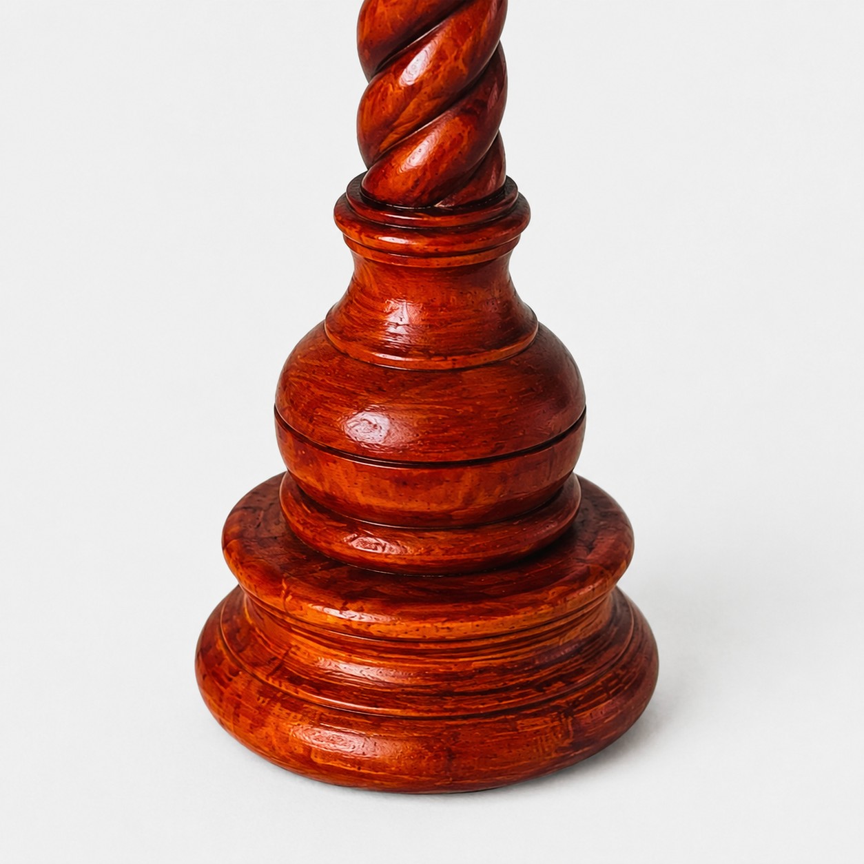 Polished sculpted wood base detail