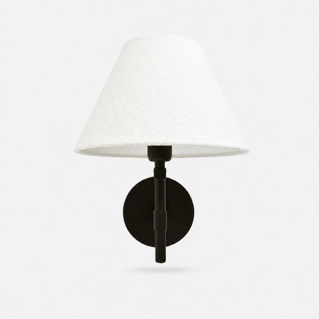 White fabric shade with black iron wall fixture