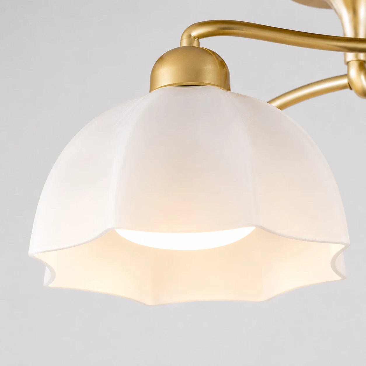 Flower-shaped white glass shade detail