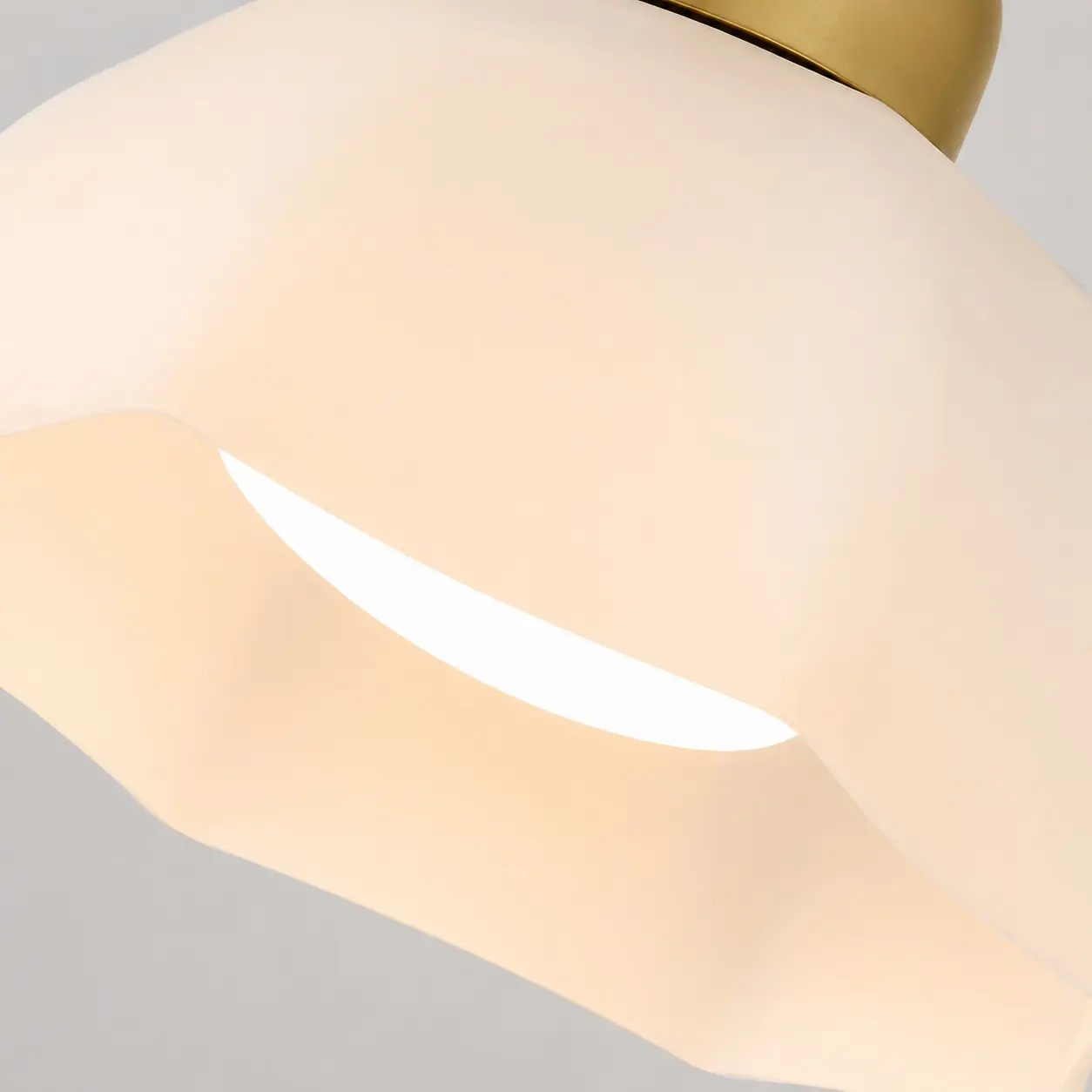 Close-up of a sculpted white glass lampshade
