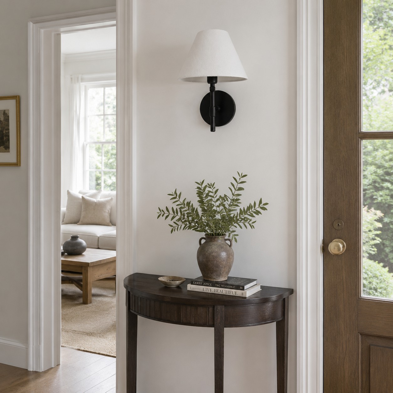 Fabric shade wall sconce with black iron frame