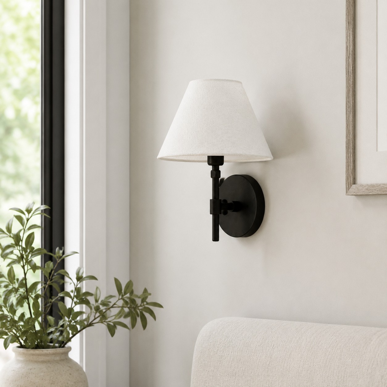 Fabric shade wall sconce with black iron frame