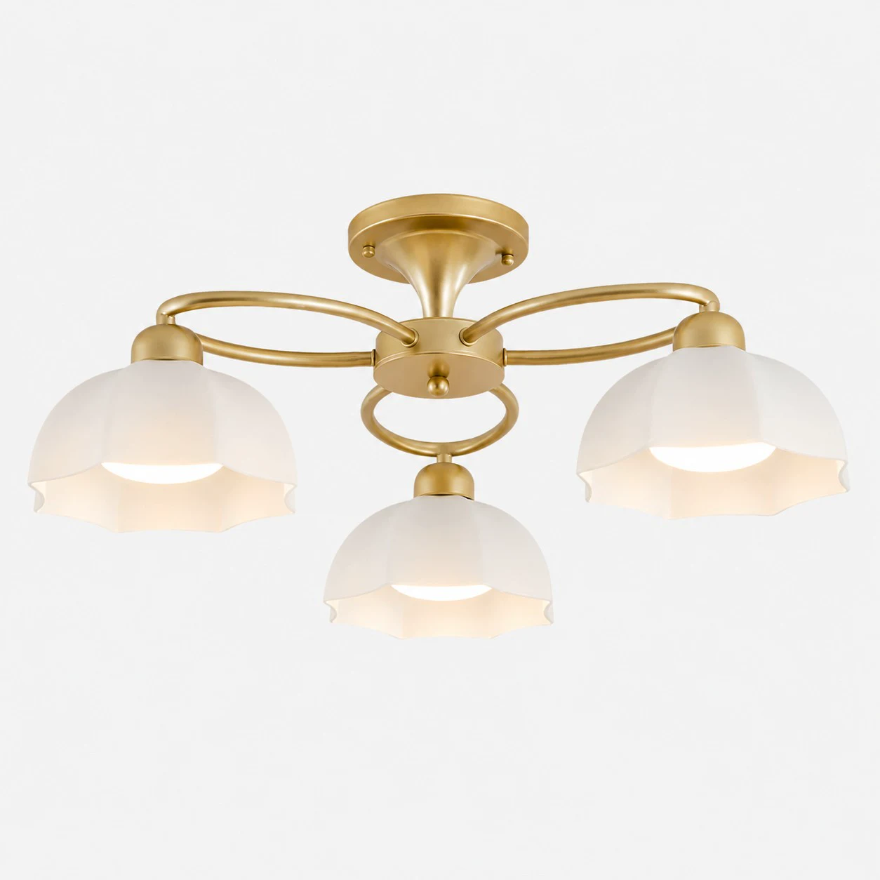 Three-light brass-tone ceiling fixture with white glass shades