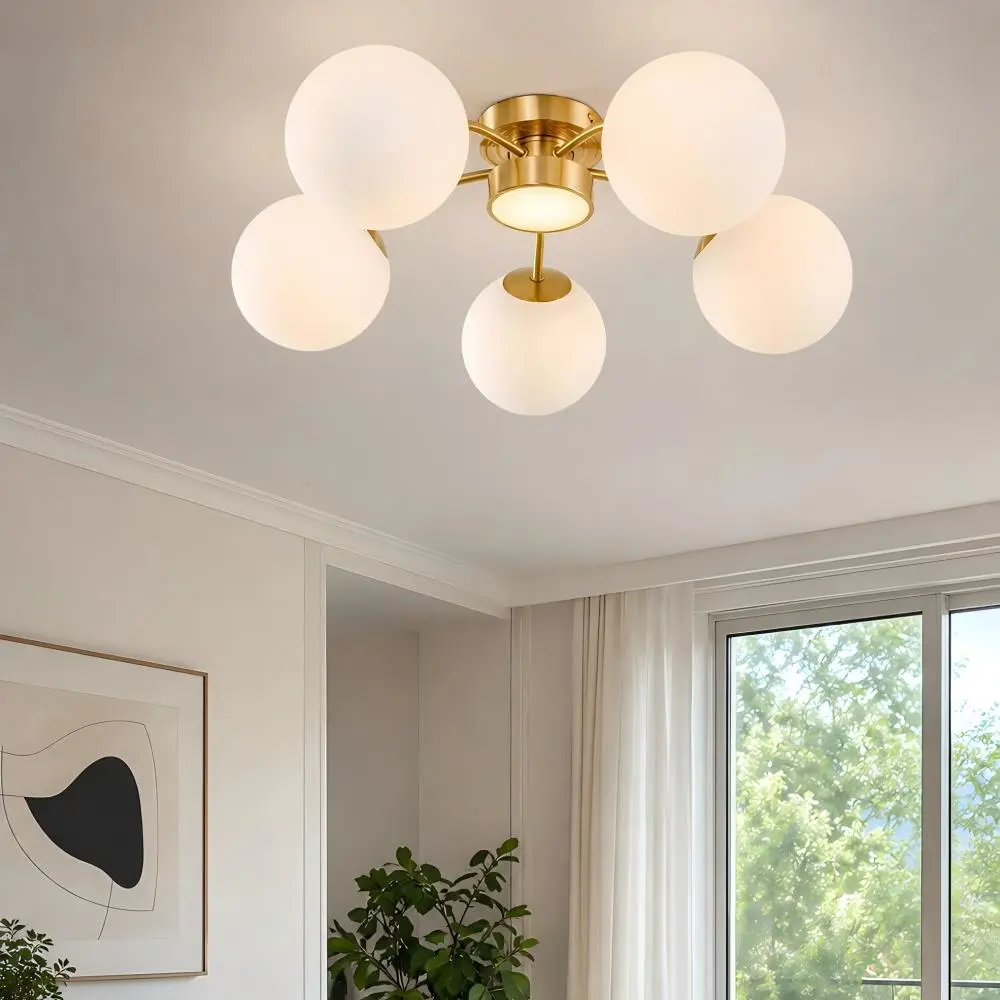 Brass globe ceiling light in a bright contemporary interior