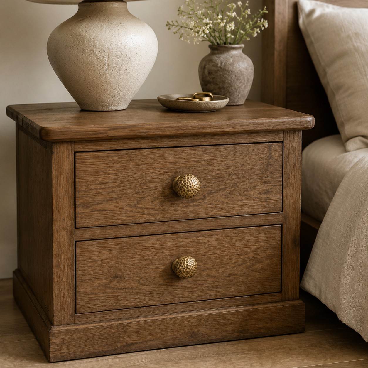 Hammered brass knobs installed on cabinetry