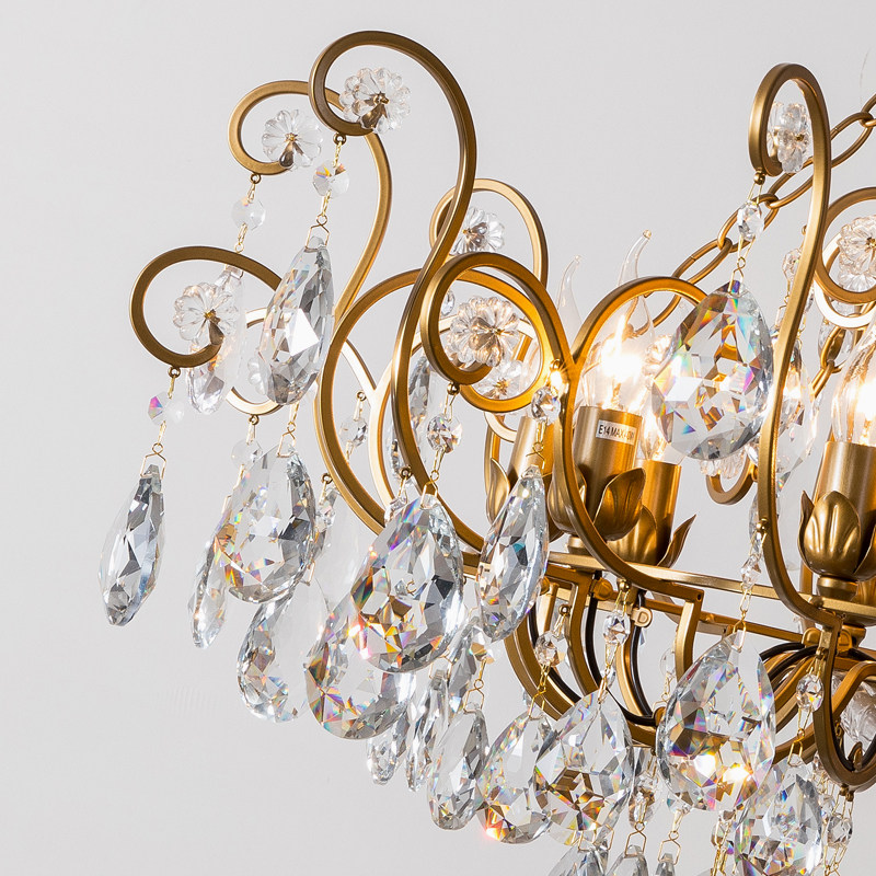 Scrolling brass frame with faceted crystal drops