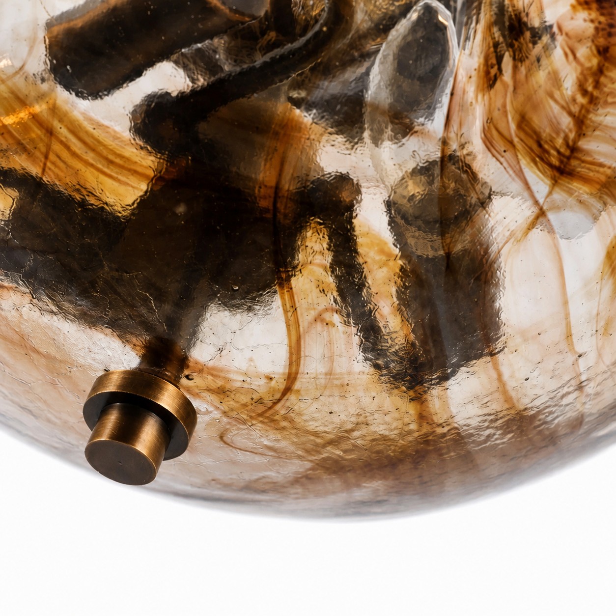 Textured amber glass and antique brass finial detail