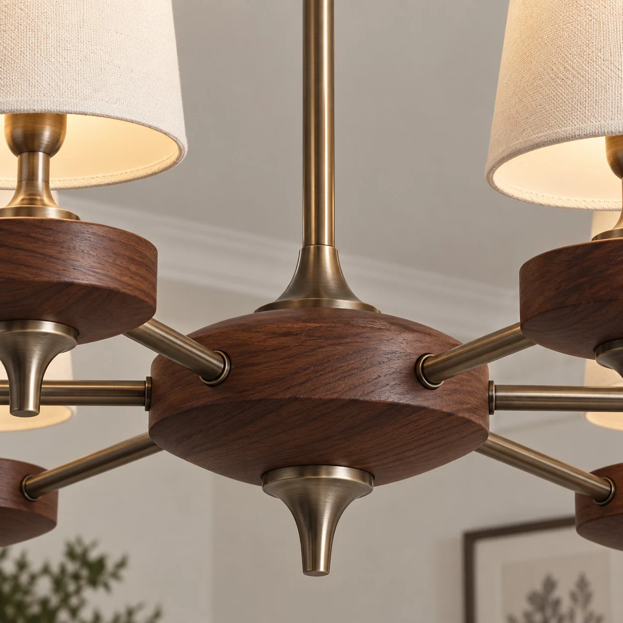 Walnut-toned central hub and antique-bronze arms